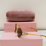 Miu miu Sunglasses